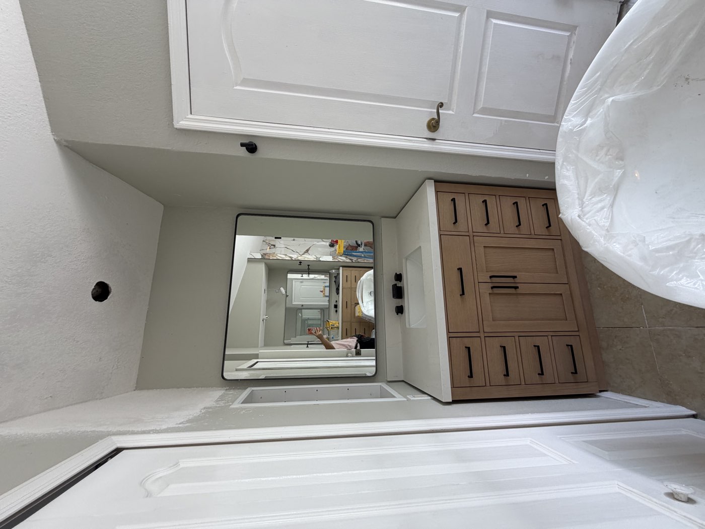 Installed interior door beside a finished vanity