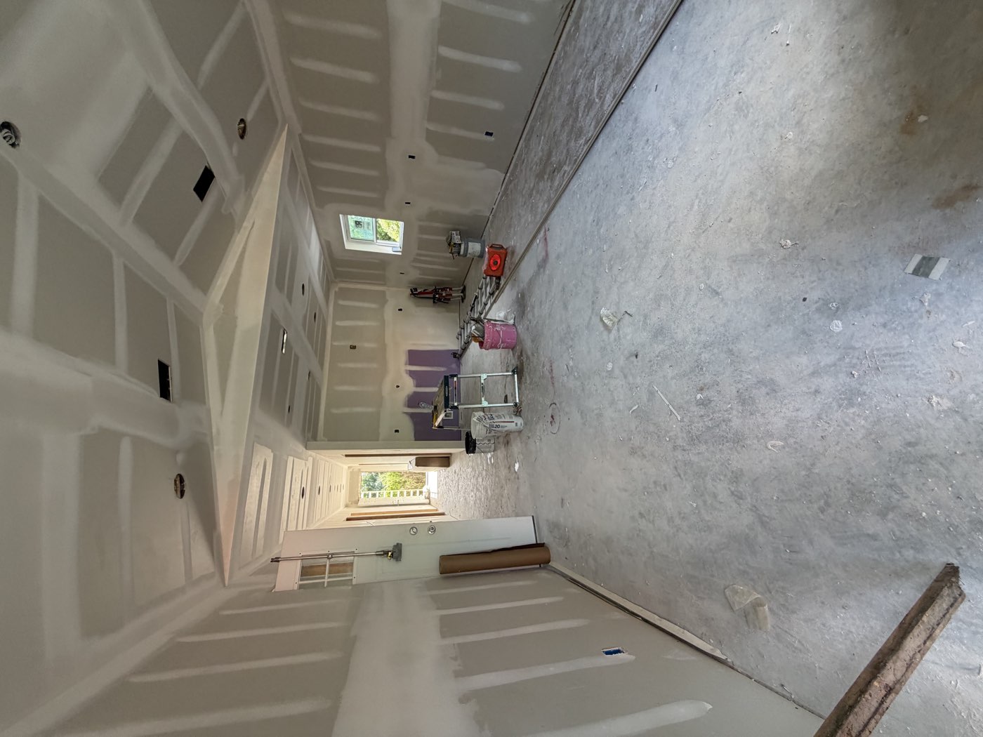 Drywall hung, taped and finished in an open living area
